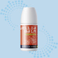 Wella Balm bottle on a light blue background with decorative elements